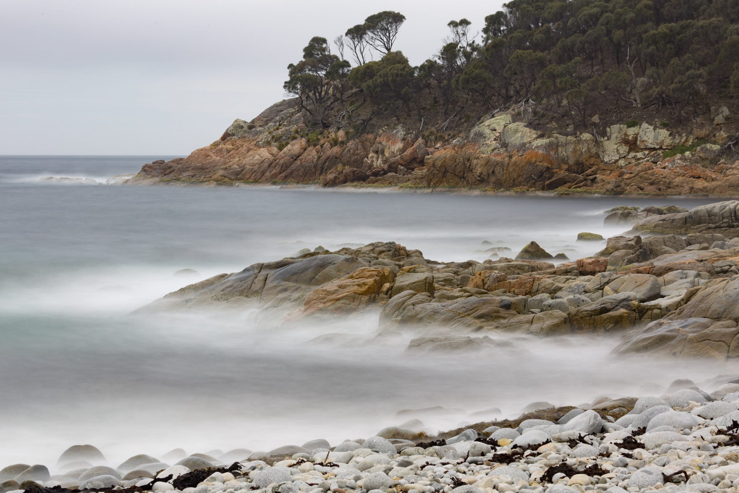 Here's a good example of compression in a landscape photo.  The three levels of land jutting into the sea are compressed together by the tendency of telephoto lenses to magnify images that are further away relative to the foreground.  This shot is taken with a 3 stop ND filter with the aperture at f16  to slow the shutter to 30 seconds.  This creates the softness in the water, and also gives enough depth of field to include both the foreground and background.